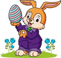 The cute rabbit is holding the easter egg