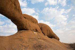 Scenic natural view of a stone natural arch seen from below. Damaraland, Namibia photo