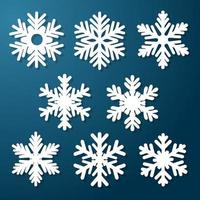 conjunto de copos de nieve blancas sobre un fondo azul. artículos decorativos para navidad, año nuevo. decoración festiva. ilustración vectorial. vector