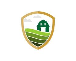 Simple shield with farm and barn inside vector