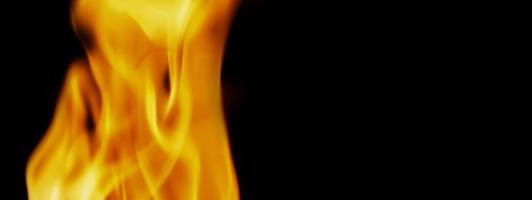 Fire background. Abstract burning flame and black background. photo