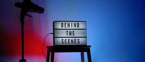 Movie board light box on studio stair and light Snoot tripod on colors gradiant Background. photo