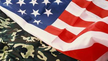 American flag and Military camouflage pattern. Top view angle. photo