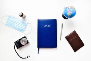 Top view travel accessories on white isolated background photo