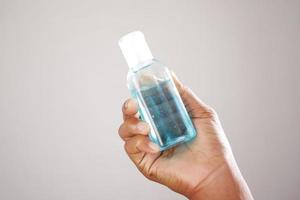 Using sanitizer liquid for preventing corona virus photo