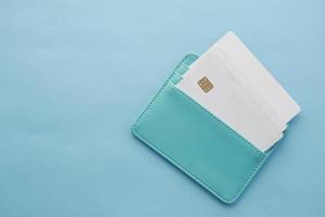 close up of credit cards in a wallet on light green background photo