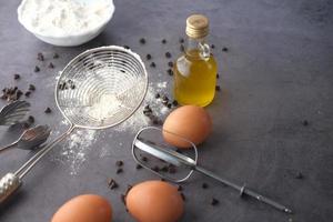 Baking ingredients on a black background, top view. photo