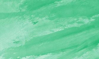 Creative abstract hand painted background with jade color photo