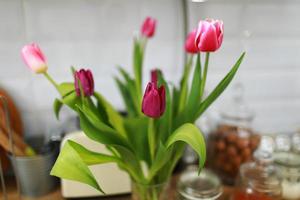 Bouquet of tulips on the kitchen background. photo