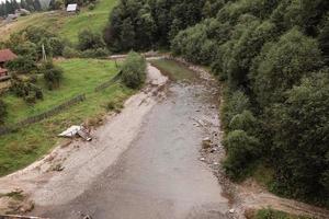 Top view of a mountain river. mountain river flowing near the settlement. photo