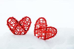 Wooden red heart made of twigs on white background. Eco-friendly valentines day. photo
