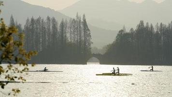 The beautiful lake landscapes in the Hangzhou city of the China in spring with the sunset sunlight photo