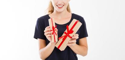 Woman, girl holding stack of gift isolated on white background. photo