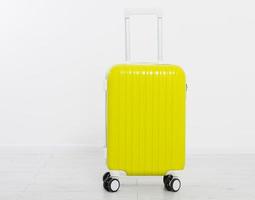 Yellow suitcase isolated on white background .Summer holidays. Travel valise or bag. Mock up. Copy space. Template. Blank.