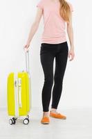 girl with yellow suitcase isolated on white background .Summer holidays. Travel valise or bag. Mock up. Copy space. Template. Blank.