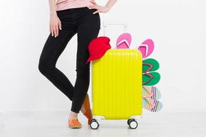 girl with suitcase isolated on white background .Summer holidays. summer flip flops or slippers. Travel valise or bag. Mock up. Copy space. Template. Blank. photo