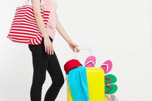 girl with suitcase isolated on white background .Summer holidays. summer flip flops or slippers. Travel valise or bag. Mock up. Copy space. Template. Blank.