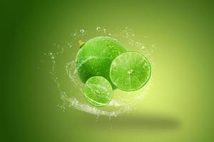 Lime and mint with water splash isolated on Green background