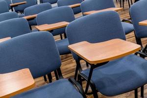 Chair and table in the empty lecture and training class. Close up. classroom photo