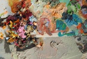 dried multi-colored paint. top view. concept artistic and creative chaos photo