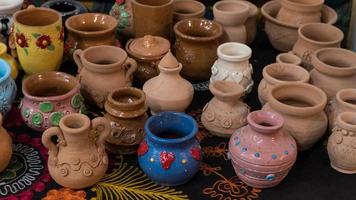 lots of beautifully decorated clay pots. children's crafts photo