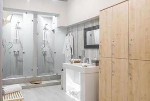 Modern shower room interior with wardrobes photo