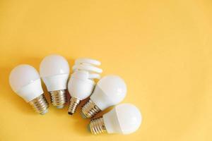 LED light bulbs on yellow background photo