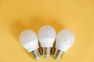 LED light bulbs on yellow background photo