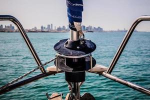 Prow of a sailboat. In the background there are buildings of Tel Aviv, Israel photo