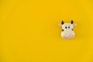 Cow icon on yellow background photo