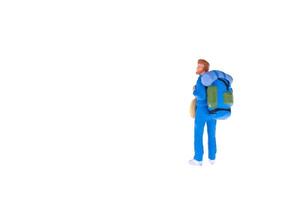 Close up of Miniature backpacker and tourist people isolate on white background. Elegant Design with copy space for placement your text, mock up for travel concept photo