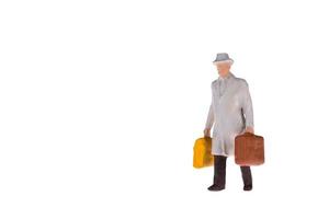 Close up of Miniature businessman and tourist people isolate on white background. Elegant Design with copy space for placement your text, mock up for travel concept photo