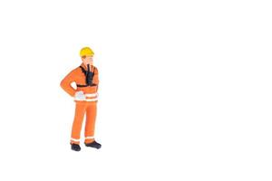 Close up of Miniature people in engineer and worker occupation isolate on white background. Elegant Design with copy space for placement your text, mock up for industrial and construction concept photo