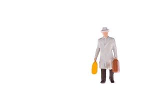 Close up of Miniature businessman and tourist people isolate on white background. Elegant Design with copy space for placement your text, mock up for travel concept photo