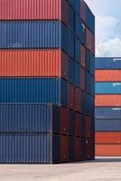 Colourful stack pattern of cargo shipping containers in shipping yard for logistic import and export industrial photo