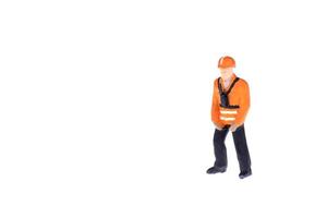 Close up of Miniature people in engineer and worker occupation isolate on white background. Elegant Design with copy space for placement your text, mock up for industrial and construction concept photo