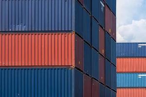 Colourful stack pattern of cargo shipping containers in shipping yard for logistic import and export industrial photo