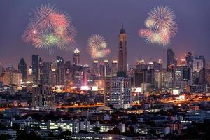 Fireworks light up show on sky over Bangkok City downtown at night,Thailand. Bangkok is the most populated city in Southeast Asia. photo