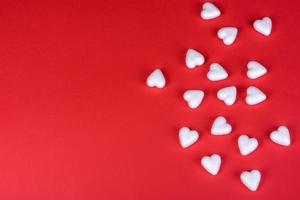 Several figures in the shape of hearts on a red one-ton background photo