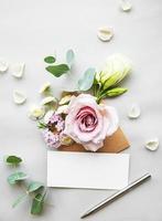 Envelope full of various flowers photo