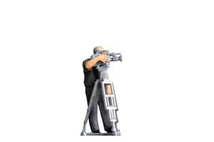 Cameraman working with television camera on a tripod isolated on white background with clipping path photo