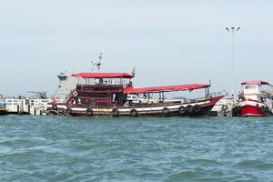 Parking fishing vessels on the island in Thailand. photo