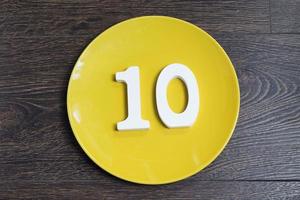 Number ten on a yellow plate. photo