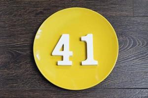 Number forty one on the yellow plate. photo