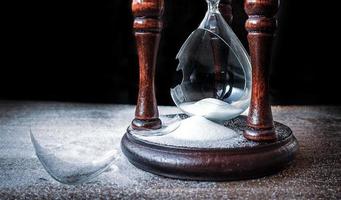 Broken hourglass - sand clock photo