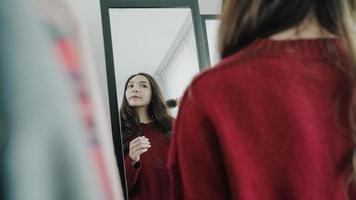 Portrait of beautiful attractive Asian woman combing her hair and choosing clothes in her dressing room at home. Lifestyle women using relax time at home concept. photo