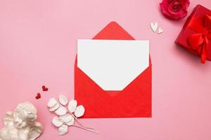 Flat lay envelope with blank mock up sheet for Valentine's Day photo