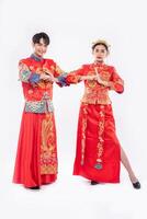 Men and women wear qipao to pay their respects. Isolated on white background photo