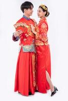 The man and woman wear Cheongsam glad to receive gift money and cash photo