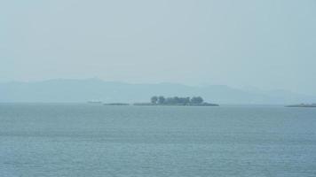 The beautiful lake landscapes in the Hangzhou city of the China in spring with the peaceful lake and fresh green mountains photo